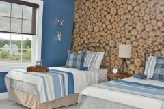 Designer Roller Shades with Fun Wall Covering in the bedroom